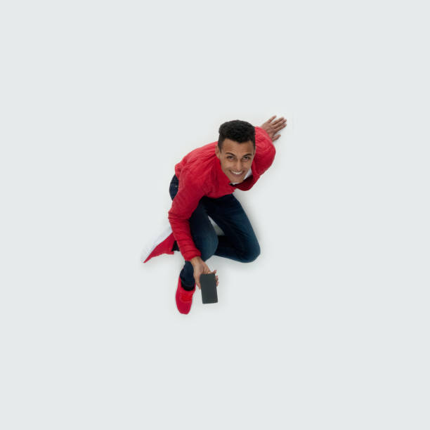 istock Directly above view / aerial view / full length / looking at camera / looking up / one man only / one person of 20-29 years old adult handsome people black hair / short hair african ethnicity / african-american ethnicity male / young men 1191753373