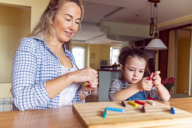 istock Happy Mother and Daughter is Playing with Plasticine 1191756434