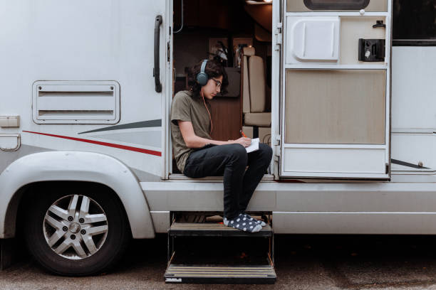 istock teenager doing homework motor home 1191757635