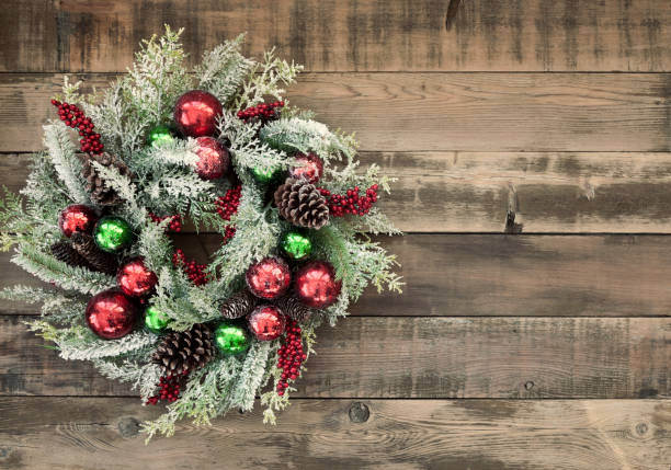 istock Christmas wreath on old wood background 1191758941