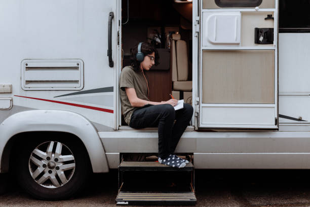 istock teenager doing homework motor home 1191759614