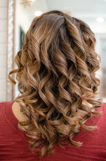 istock Long brown hair curled the process of creating 1191759682
