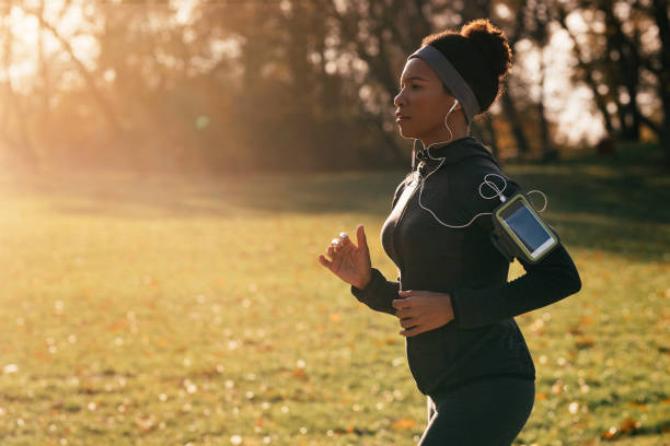 istock Dedicated African American athlete jogging in nature. 1191761505