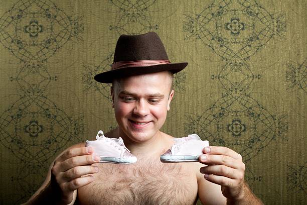 istock Man with little shoes 119176429