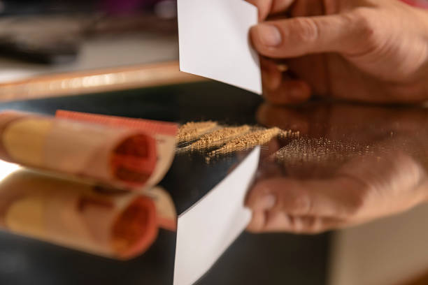 istock Man is Preparing a Lines of Drugs for Snorting 1191764614