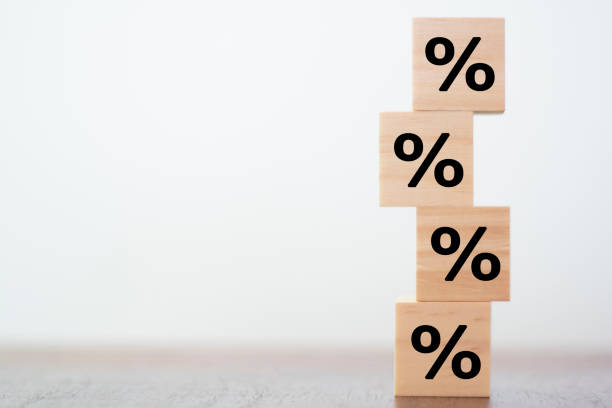 istock Percentage Sign on wooden cubes 1191765455