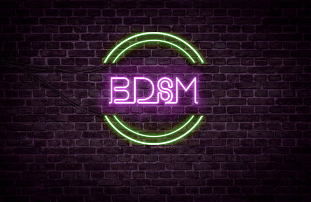 istock A green and purple neon light sign that reads: BDSM 1191768688