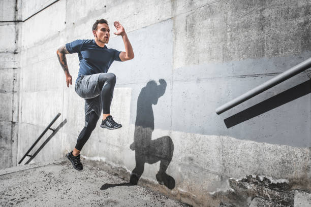 istock Sprinting Male Athlete with High Knee Action on Staircase 1191770075