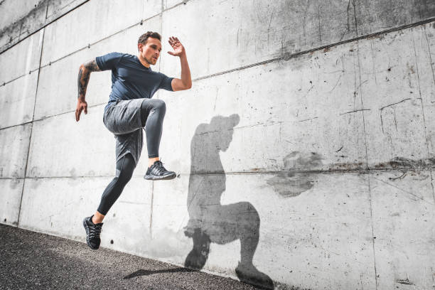 istock Male Athlete Running with Good Form and High Knee Action 1191770077