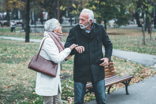 istock Mature Couple Having a Debate in the Public Park 1191770112