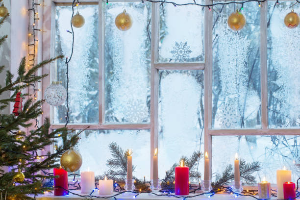 istock Christmas decorations on old wooden window 1191770450