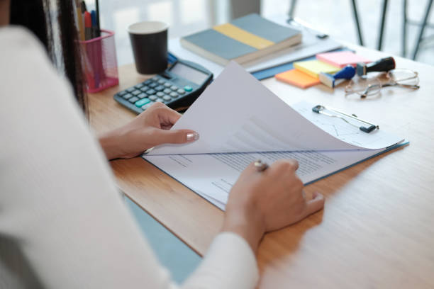 istock businesswoman working with document. startup woman analyzing data. student studying doing assignment 1191770657