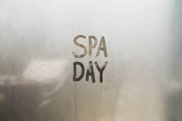 Spa Day Message on Steamy Glass Window