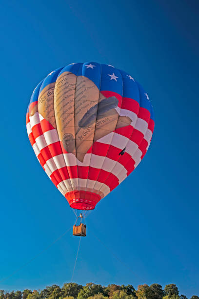 istock Light strikes a hot air balloon in a blue sky. 1191778871