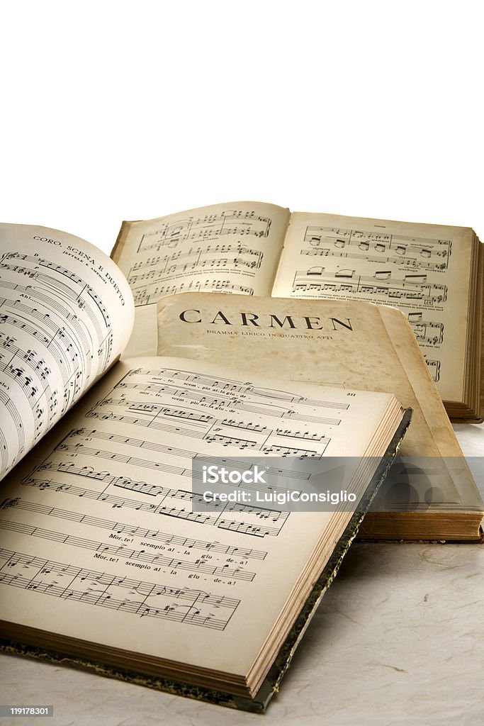 Sheet Music In the foreground, the musical score of the opera "Prodigal Son", the author A. Ponchiellii,"Carmen"the author Giorgio Bizet Book Stock Photo