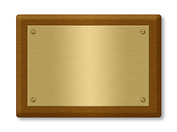a blank gold plaque on a wooden support - goud metaal fotos stockfoto's en -beelden