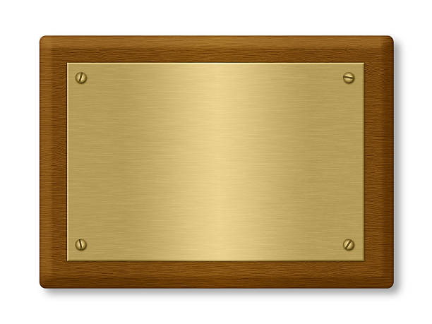 istock A blank gold plaque on a wooden support 119178367