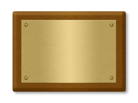 A blank gold plaque on a wooden support