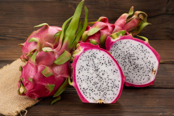 istock Pitaya or Dragon Fruit isolated against wood background 1191788054