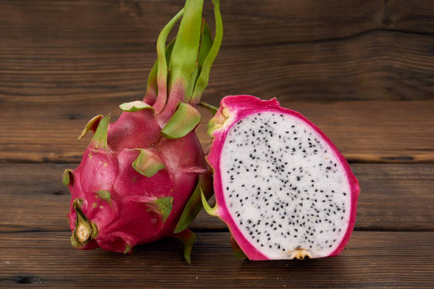 istock Pitaya or Dragon Fruit isolated against wood background 1191788211