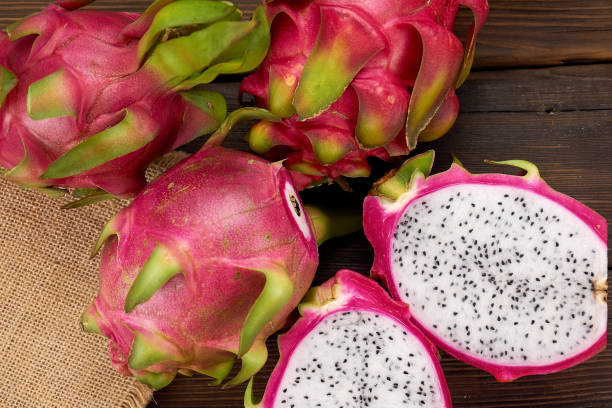 istock Pitaya or Dragon Fruit isolated against wood background 1191788265