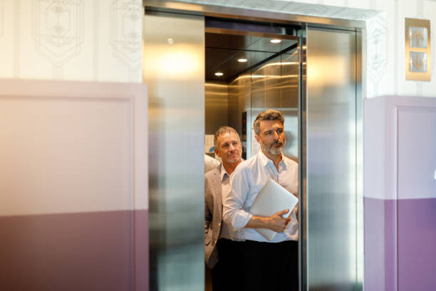 istock Businessman getting out of the elevator 1191790529