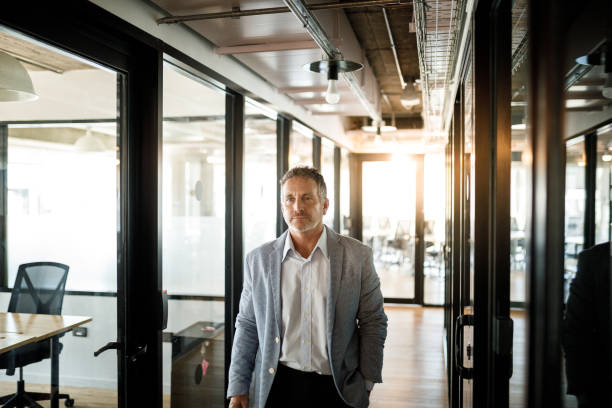 istock Businessman walking the office corridor 1191790545