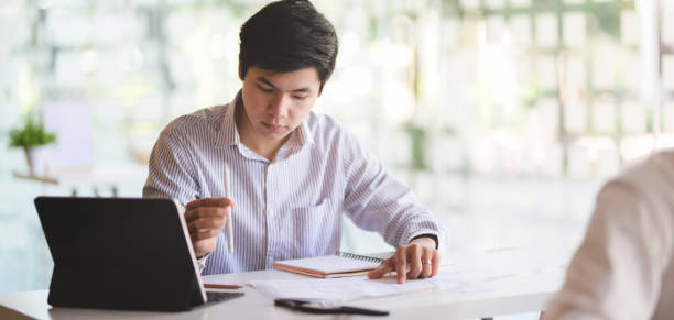 istock Cropped shot of professional architect  working on the construction plan with tablet 1191791242