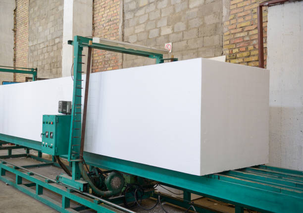 plant for the production of sandwich panels from styrofoam The machine cuts foam plastic. Plant for the production of sandwich panels from styrofoam sandwich panel photos stock pictures, royalty-free photos & images