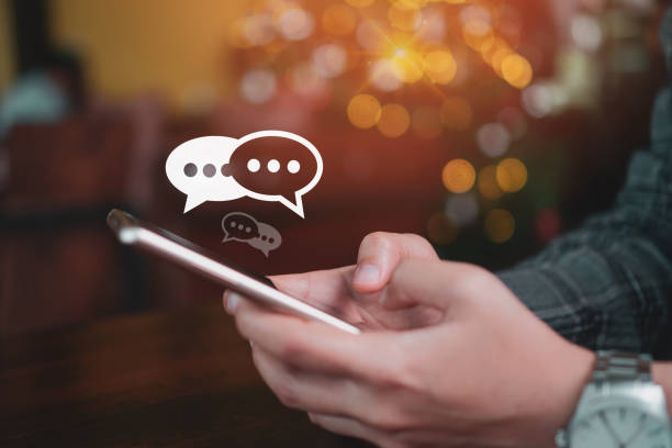 istock Women hand using smartphone typing, chatting conversation in chat box icons pop up. Social media maketing technology concept.Vintage soft color tone background. 1191798463