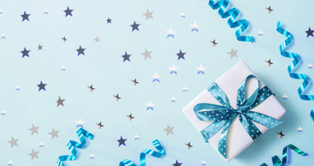 istock Gift box with confetti and ribbons 1191801889