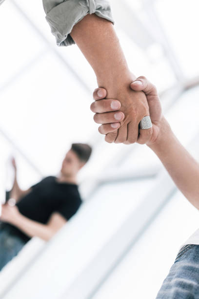 istock close up. handshake business partners on blurred office background . 1191805254