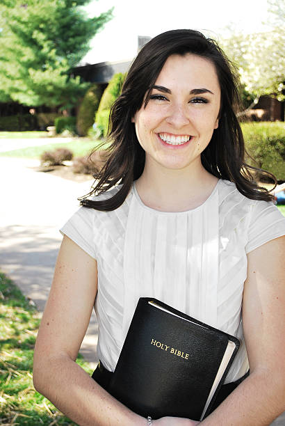 istock Young woman holding a Bible 119180699