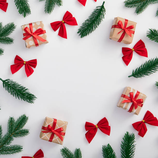 istock Christmas tree branch and red bow decoration 1191808392