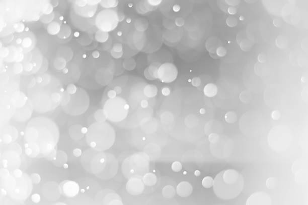 istock Silver and white bokeh lights defocused. Blurred background. 1191809300