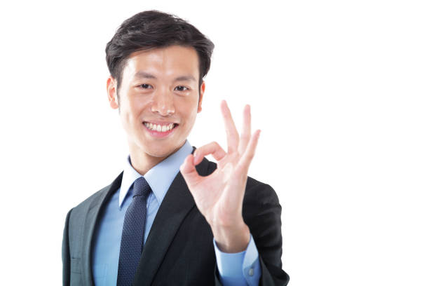 istock Young Asian Businessman Hand Gesturing Okay Sign 1191813143