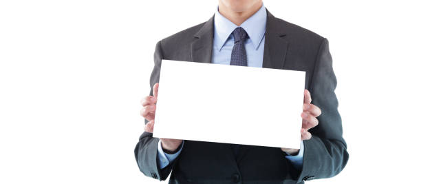 istock Young Businessman Holding a Blank Sign on White Background 1191813175