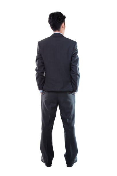 Rear View of a Businessman Standing on White Background