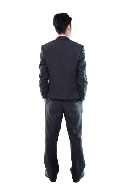 Rear View of a Businessman Standing on White Background Rear View of a Businessman Standing on White Background back of head photos stock pictures, royalty-free photos & images