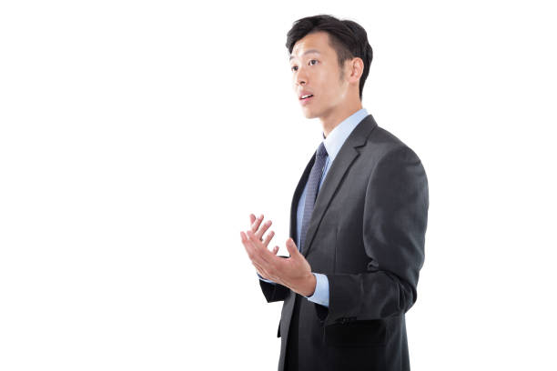 istock Handsome Asian Businessman in Conversation on White Background 1191814420