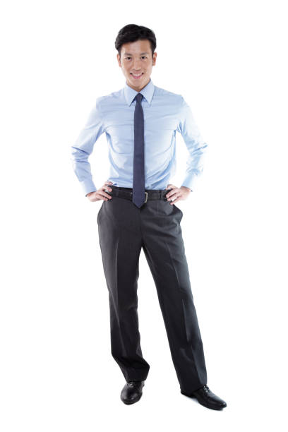 istock Confident Asian Businessman with Hands on Hip Looking at Camera Smiling on White Background 1191814463