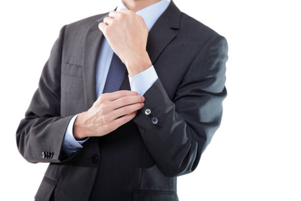 Close-up of Businessman Buttoning Getting Ready on White Background.