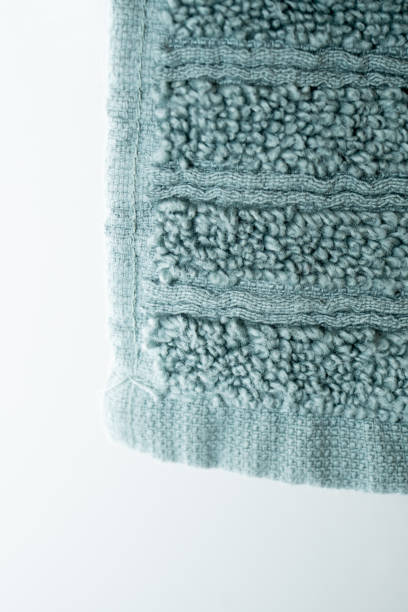 istock Green soft plush towel hanging from hanger background close up 1191815019