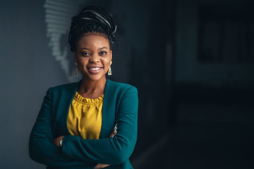 Portrait of young African businesswoman in the office looking at camera.