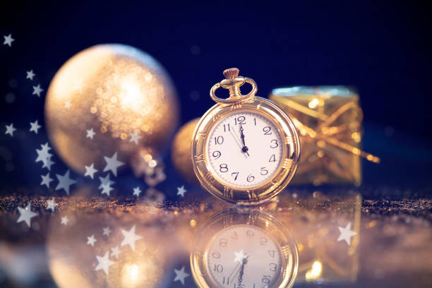 istock New Year's at midnight - Old clock with holiday lights 1191816106