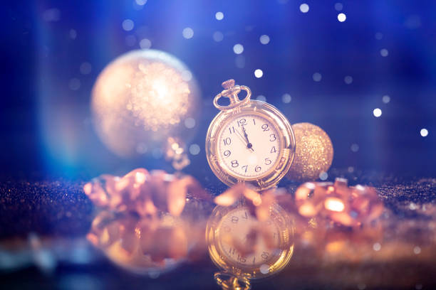 istock New Year's at midnight - Old clock with holiday lights 1191816124
