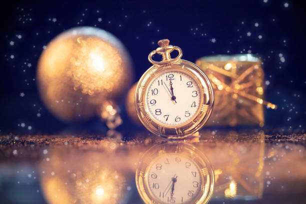 istock New Year's at midnight - Old clock with holiday lights 1191816160