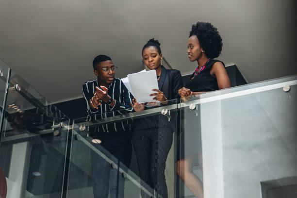 istock Business People Talking In Office Lobby 1191817121