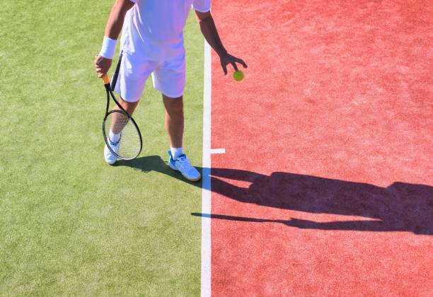 istock Confident mature man playing tennis on sunny day 1191818191