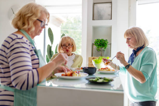 istock Friends socializing over lunch at home 1191819237